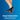Black compression socks with gray toes on a blue background, featuring text about snug compression.